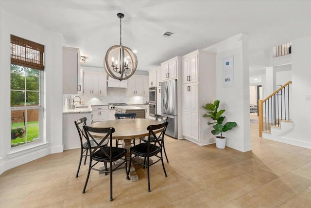 5304 China Garden Dr, Austin, TX 78730 - dining space with a chandelier and stairway