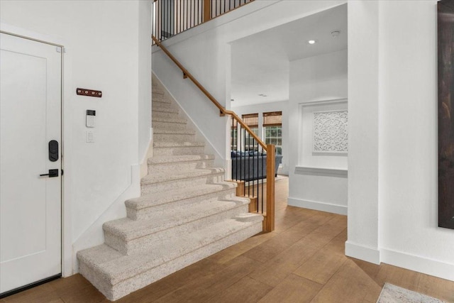 5304 China Garden Dr, Austin, TX 78730 - stairs with wood finished floors and baseboards