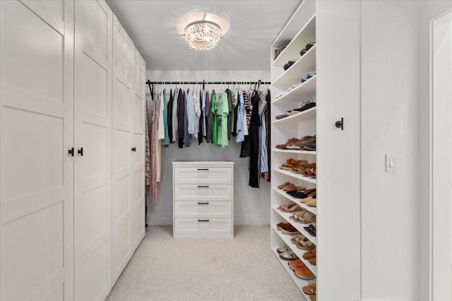 5304 China Garden Dr, Austin, TX 78730 - spacious closet featuring a chandelier and light carpet