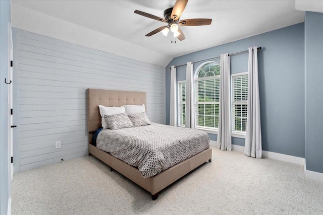 5304 China Garden Dr, Austin, TX 78730 - bedroom with carpet flooring, vaulted ceiling, ceiling fan, and wood walls