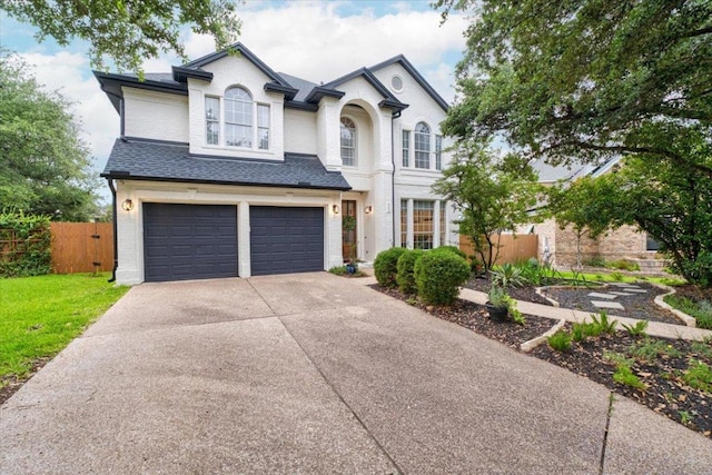 5304 China Garden Dr, Austin, TX 78730 - view of front of property with concrete driveway, an attached garage, and a shingled roof