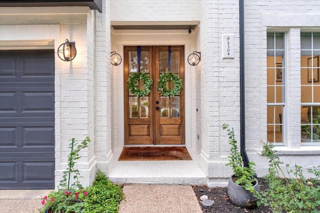 5304 China Garden Dr, Austin, TX 78730 - doorway to property with french doors, brick siding, and a garage