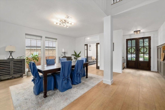 5304 China Garden Dr, Austin, TX 78730 - dining room featuring healthy amount of natural light, wood finished floors, and french doors
