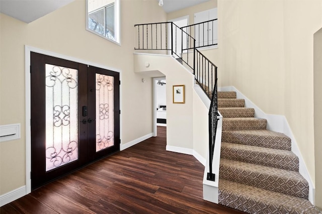 7606 Mesa Dr, Austin, TX 78731 - foyer featuring wood finished floors, stairway, healthy amount of natural light, french doors, and a towering ceiling