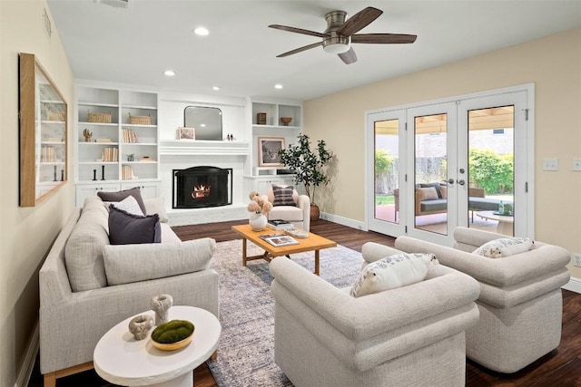 7606 Mesa Dr, Austin, TX 78731 - living area with dark wood-style flooring, a ceiling fan, a fireplace with flush hearth, french doors, and recessed lighting