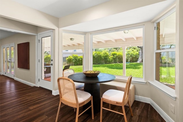 7606 Mesa Dr, Austin, TX 78731 - dining space with plenty of natural light and dark wood-style floors