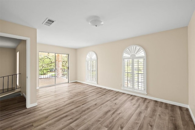 7606 Mesa Dr, Austin, TX 78731 - spare room with wood finished floors and baseboards