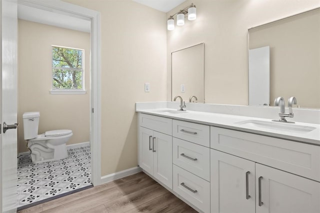 7606 Mesa Dr, Austin, TX 78731 - bathroom with double vanity and wood finished floors