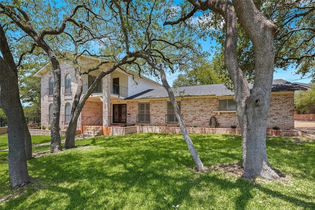 7606 Mesa Dr, Austin, TX 78731 - traditional-style house featuring brick siding and a front yard