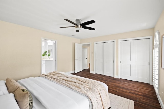 7606 Mesa Dr, Austin, TX 78731 - bedroom featuring multiple closets, dark wood-type flooring, a ceiling fan, and ensuite bathroom