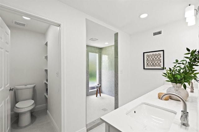 7606 Mesa Dr, Austin, TX 78731 - bathroom with double vanity, recessed lighting, and tile patterned flooring