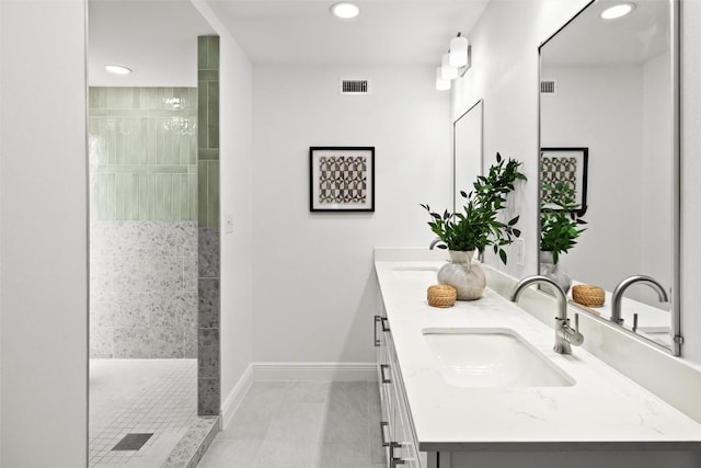 7606 Mesa Dr, Austin, TX 78731 - full bath featuring recessed lighting, double vanity, a tile shower, and tile patterned floors