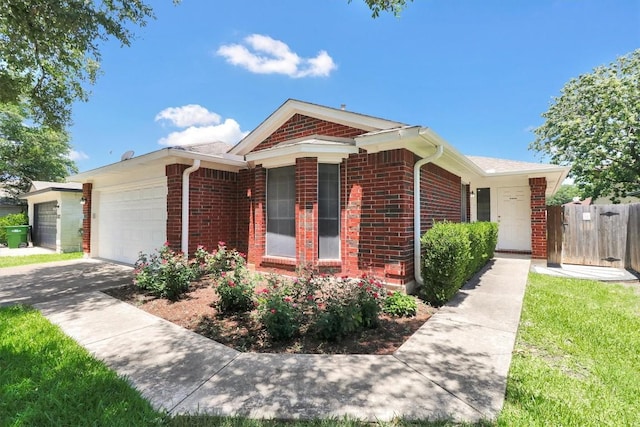 1718 Zydeco Dr, Round Rock, TX 78664 - view of front facade with brick siding, a garage, and driveway