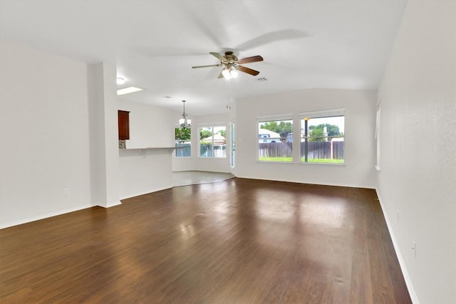 1718 Zydeco Dr, Round Rock, TX 78664 - unfurnished living room with a ceiling fan, dark wood-style floors, and a chandelier