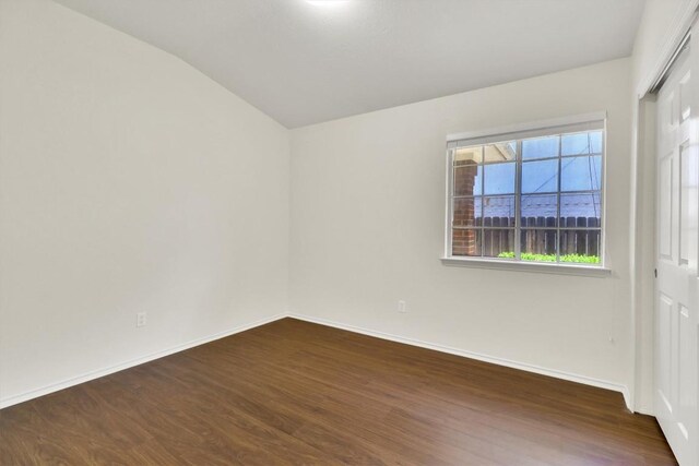 1718 Zydeco Dr, Round Rock, TX 78664 - empty room with lofted ceiling and dark wood-type flooring