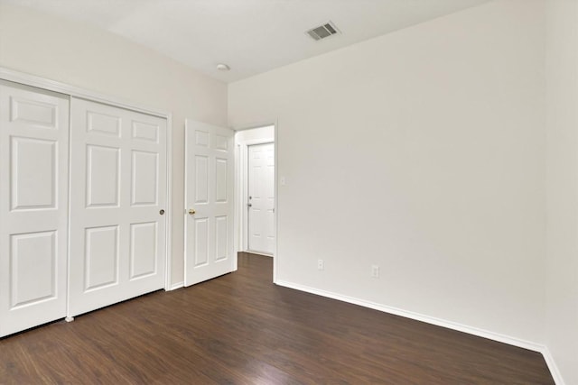 1718 Zydeco Dr, Round Rock, TX 78664 - unfurnished bedroom featuring dark wood-style floors and a closet
