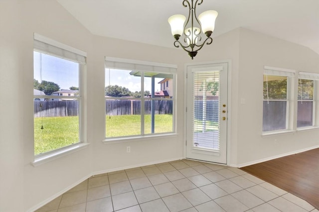1718 Zydeco Dr, Round Rock, TX 78664 - unfurnished dining area with tile patterned flooring, a chandelier, and a water view