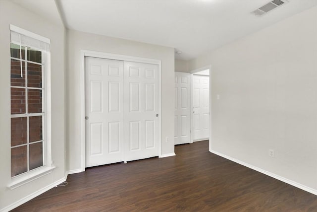 1718 Zydeco Dr, Round Rock, TX 78664 - unfurnished bedroom featuring wood finished floors and a closet