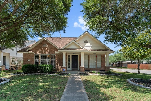 1424 Roxannes Run, Pflugerville, TX 78660 - view of front of home featuring brick siding, a porch, and roof with shingles
