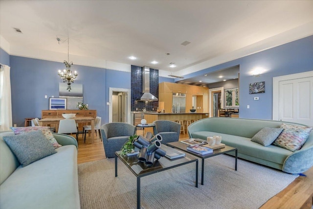 2109 Nickerson St, Austin, TX 78704 - living room featuring light wood-type flooring, a chandelier, and recessed lighting