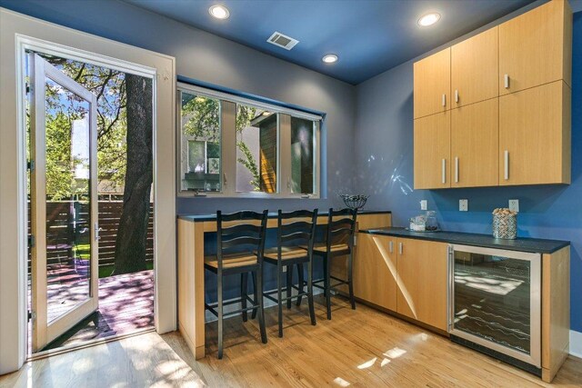 2109 Nickerson St, Austin, TX 78704 - indoor dry bar with beverage cooler, light wood finished floors, and recessed lighting