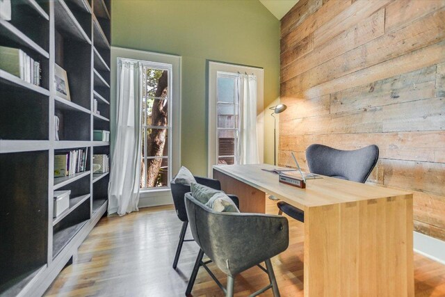 2109 Nickerson St, Austin, TX 78704 - office featuring wooden walls, high vaulted ceiling, and wood finished floors