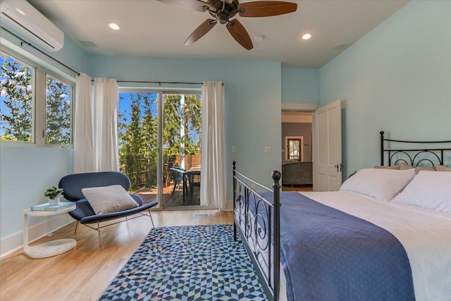 2109 Nickerson St, Austin, TX 78704 - bedroom featuring an AC wall unit, access to outside, wood finished floors, recessed lighting, and ceiling fan