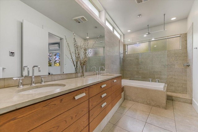 2109 Nickerson St, Austin, TX 78704 - bathroom with double vanity, healthy amount of natural light, tiled shower, and a wall mounted AC