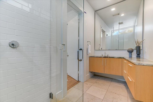 2109 Nickerson St, Austin, TX 78704 - full bathroom featuring a stall shower, vanity, tile patterned flooring, and recessed lighting