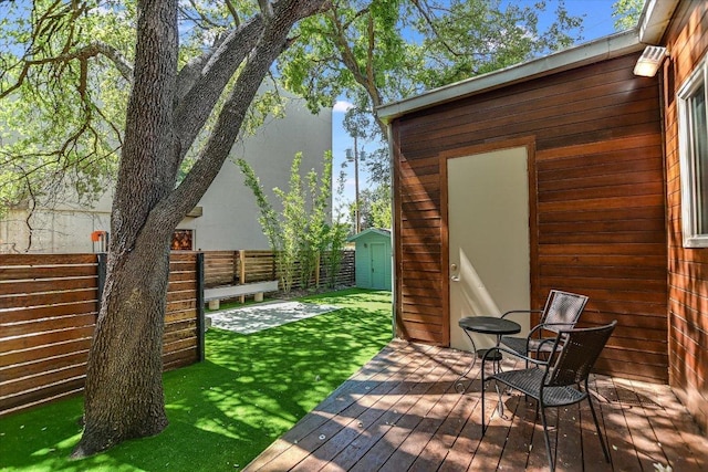 2109 Nickerson St, Austin, TX 78704 - wooden terrace featuring a storage shed and a fenced backyard