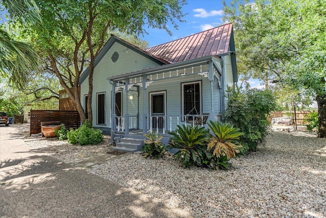 2109 Nickerson St, Austin, TX 78704 - victorian home featuring covered porch, a standing seam roof, and a metal roof