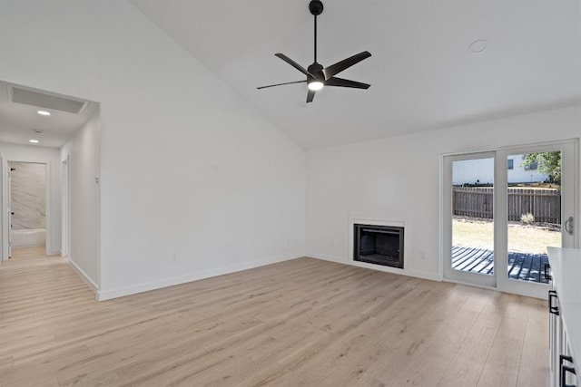 3405 Dunliegh Dr, Austin, TX 78745 - unfurnished living room with light wood-style flooring, ceiling fan, a fireplace, high vaulted ceiling, and recessed lighting