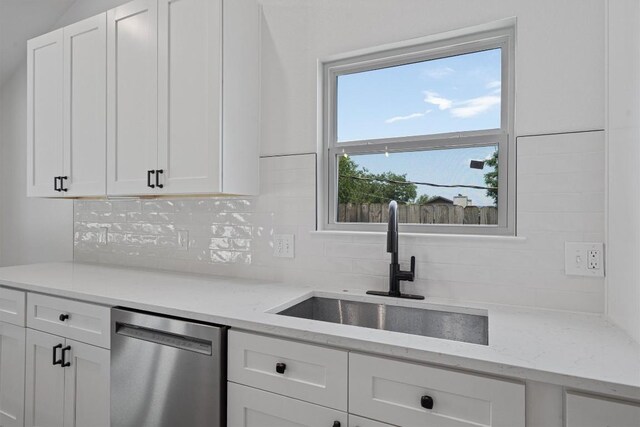 3405 Dunliegh Dr, Austin, TX 78745 - kitchen with dishwasher, decorative backsplash, white cabinetry, and light stone counters