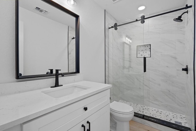 3405 Dunliegh Dr, Austin, TX 78745 - bathroom featuring vanity and a marble finish shower
