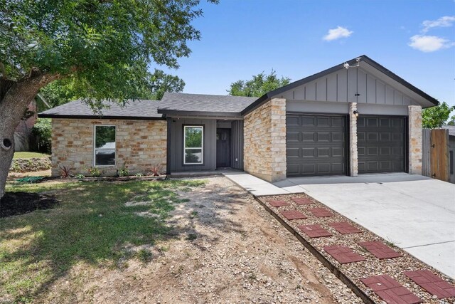 3405 Dunliegh Dr, Austin, TX 78745 - single story home featuring a garage, board and batten siding, concrete driveway, a shingled roof, and a front lawn