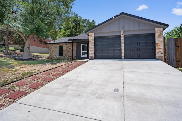 3405 Dunliegh Dr, Austin, TX 78745 - single story home with board and batten siding, concrete driveway, and a garage