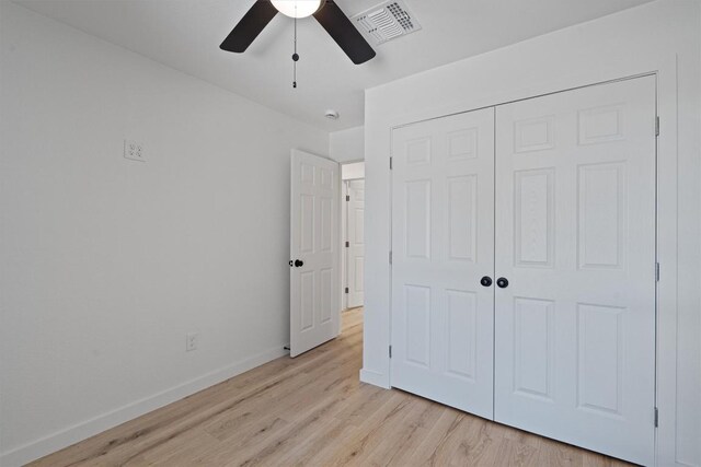 3405 Dunliegh Dr, Austin, TX 78745 - unfurnished bedroom with light wood-style floors, a closet, and ceiling fan