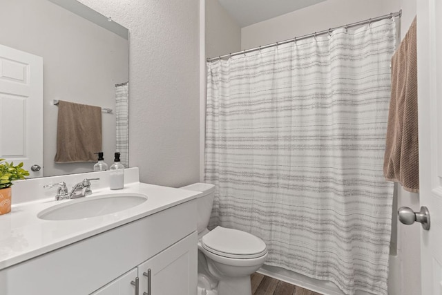 1925 T H Johnson Dr, Taylor, TX 76574 - full bath featuring vanity, wood finished floors, a shower with curtain, and a bathtub