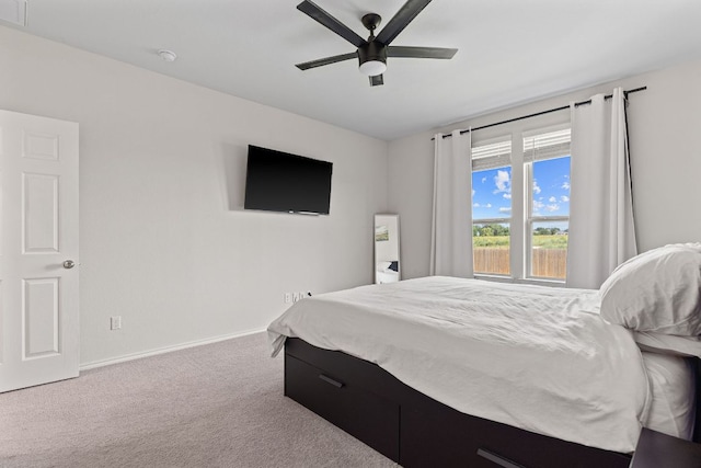 1925 T H Johnson Dr, Taylor, TX 76574 - carpeted bedroom with baseboards and ceiling fan