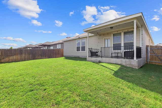 1925 T H Johnson Dr, Taylor, TX 76574 - back of house with a fenced backyard