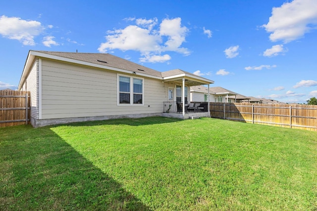 1925 T H Johnson Dr, Taylor, TX 76574 - back of house featuring a fenced backyard and a patio area