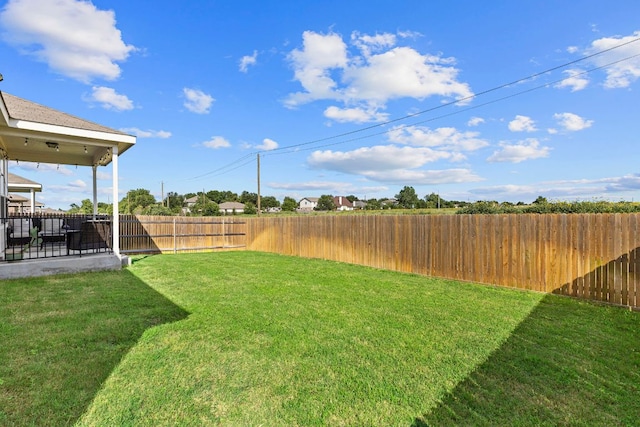 1925 T H Johnson Dr, Taylor, TX 76574 - fenced backyard with a patio area