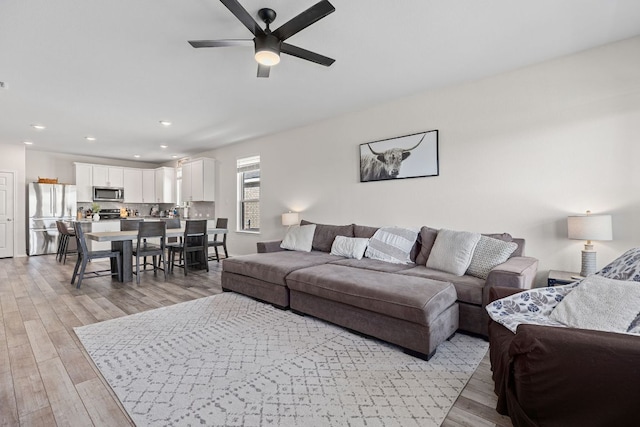 1925 T H Johnson Dr, Taylor, TX 76574 - living area with light wood-type flooring, ceiling fan, and recessed lighting