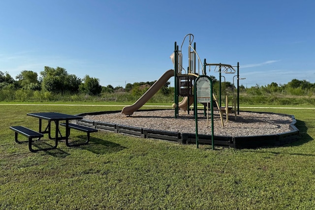 1925 T H Johnson Dr, Taylor, TX 76574 - community jungle gym featuring a lawn