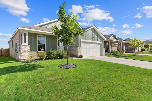 1925 T H Johnson Dr, Taylor, TX 76574 - view of front of home with board and batten siding, a garage, concrete driveway, and stone siding