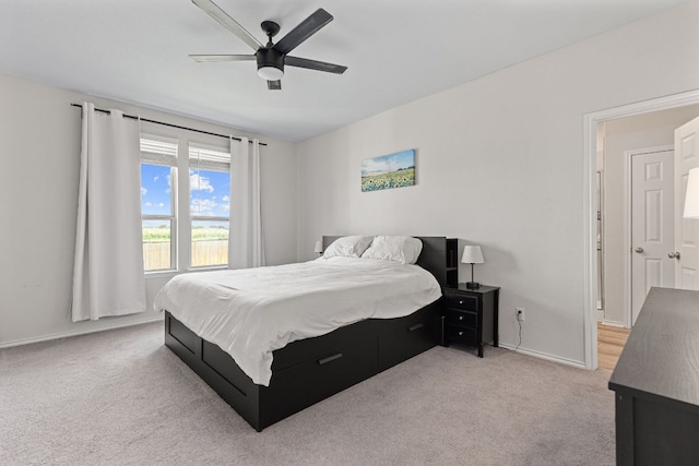 1925 T H Johnson Dr, Taylor, TX 76574 - bedroom with light colored carpet and a ceiling fan