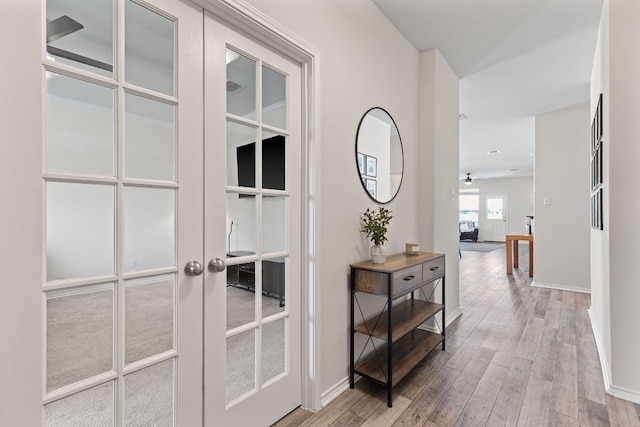 1925 T H Johnson Dr, Taylor, TX 76574 - corridor with french doors and light wood-style floors