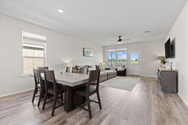 1925 T H Johnson Dr, Taylor, TX 76574 - dining area with a ceiling fan and light wood-style flooring