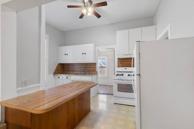 1006 Porter St, Taylor, TX 76574 - kitchen with white appliances, under cabinet range hood, a ceiling fan, light floors, and white cabinets