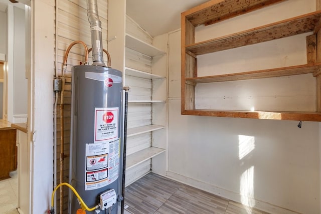 1006 Porter St, Taylor, TX 76574 - utility room with gas water heater